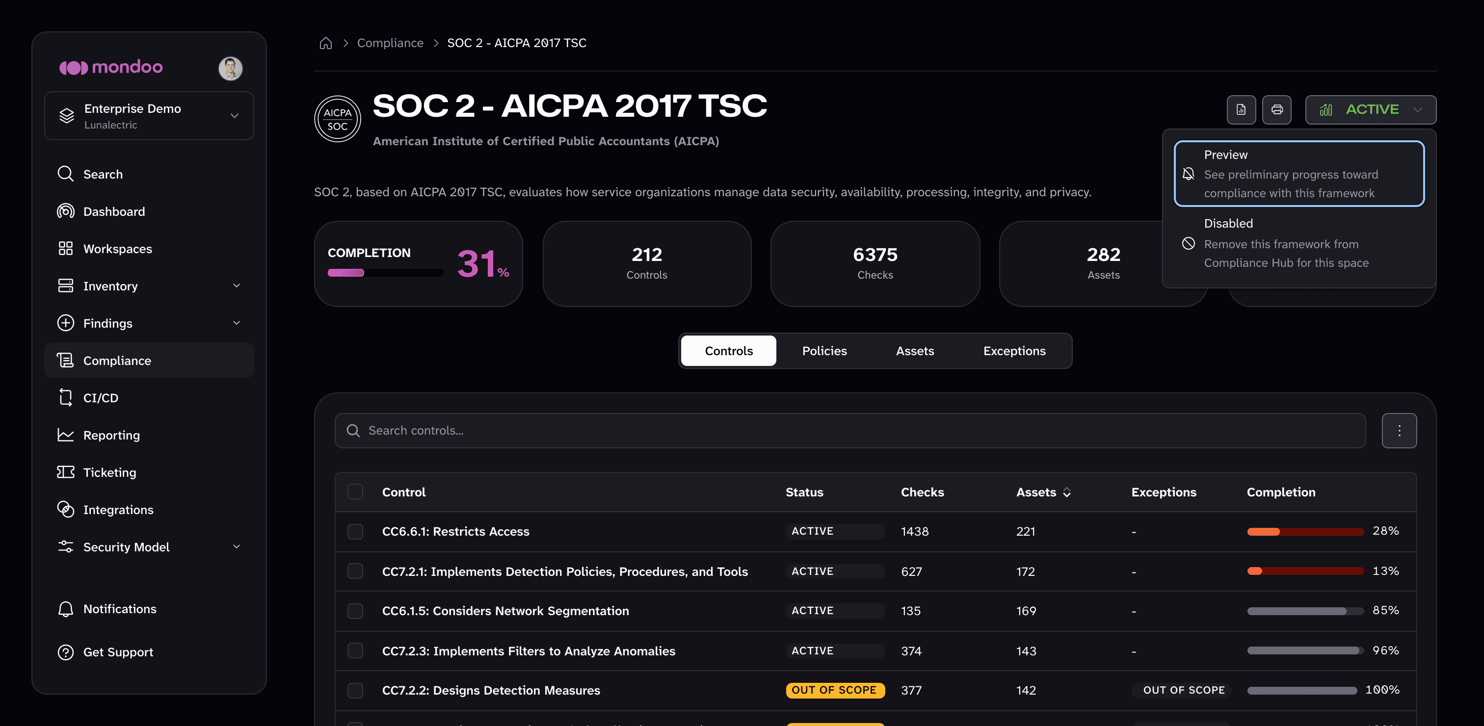 The status menu on a compliance framework's page offers Preview and Disabled