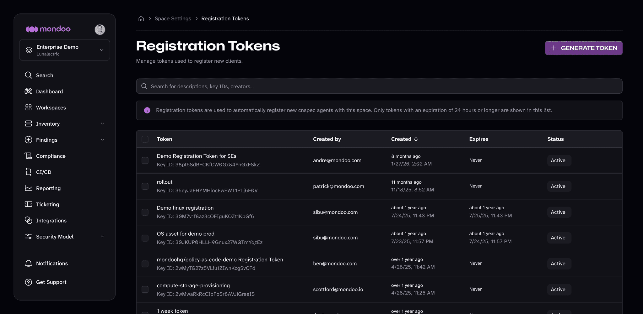 The Registration Tokens page in the Mondoo App, listing tokens with their key ID, creator, creation date, expiration, and status