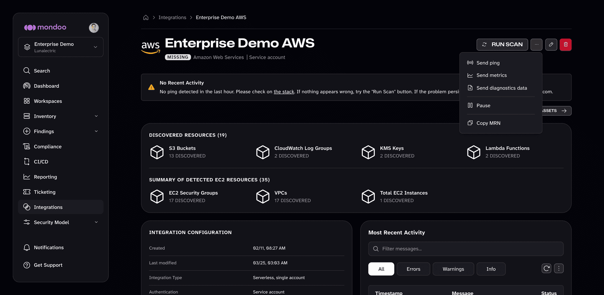Actions menu on a serverless AWS integration page in Mondoo, with Send ping, Send metrics, Send diagnostics data, Pause, and Copy MRN