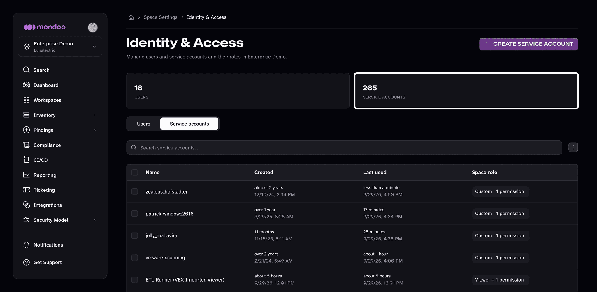 The Service accounts group on the space Identity & Access page, listing service accounts with their created and last used times and space role