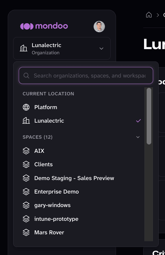 The Mondoo App navigator, with a search box spanning organizations, spaces, and workspaces, the current location marked, and the list of spaces below